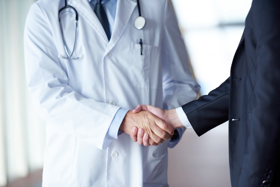 doctor shaking hand of new hire